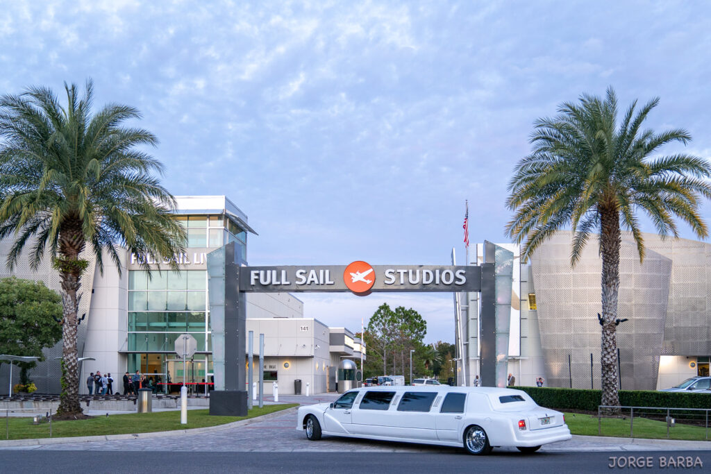 White stretch Limo entering Full Sail to drop off guests