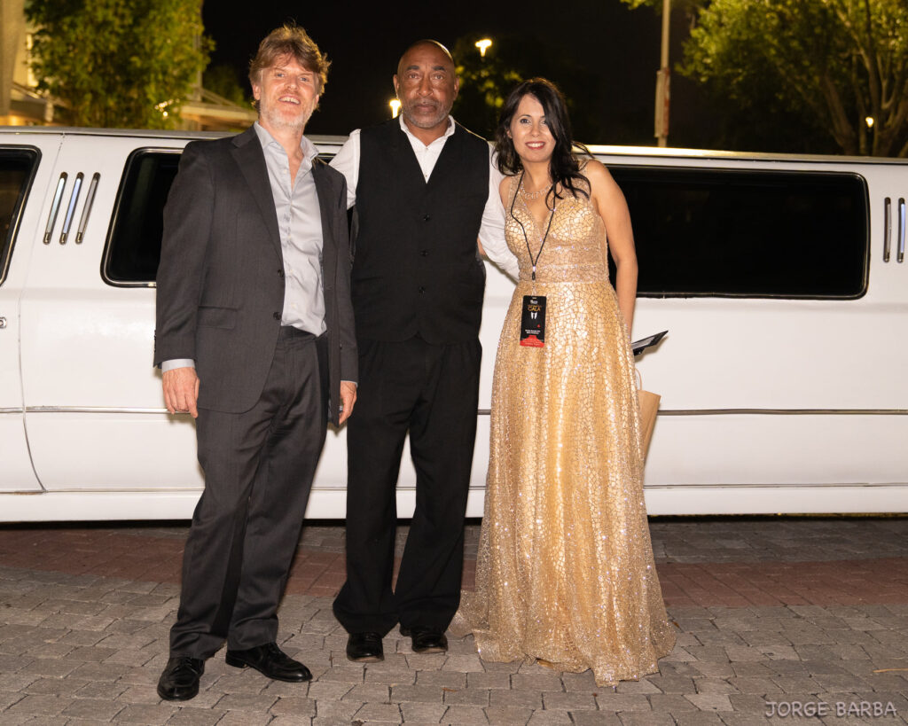 Stepping out in style in front of white stretch limo